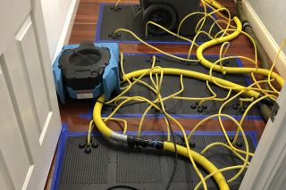 HEPA Air Scrubber Dehumidifier floorboard | New Life Restoration